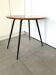 1970s coffee table in honey beech with black steel legs.