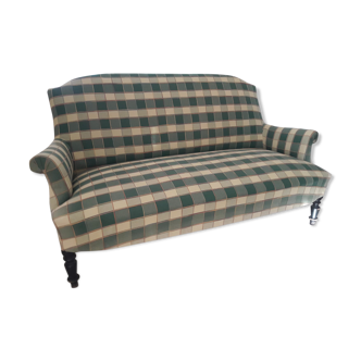 Fully retaped green checkered sofa