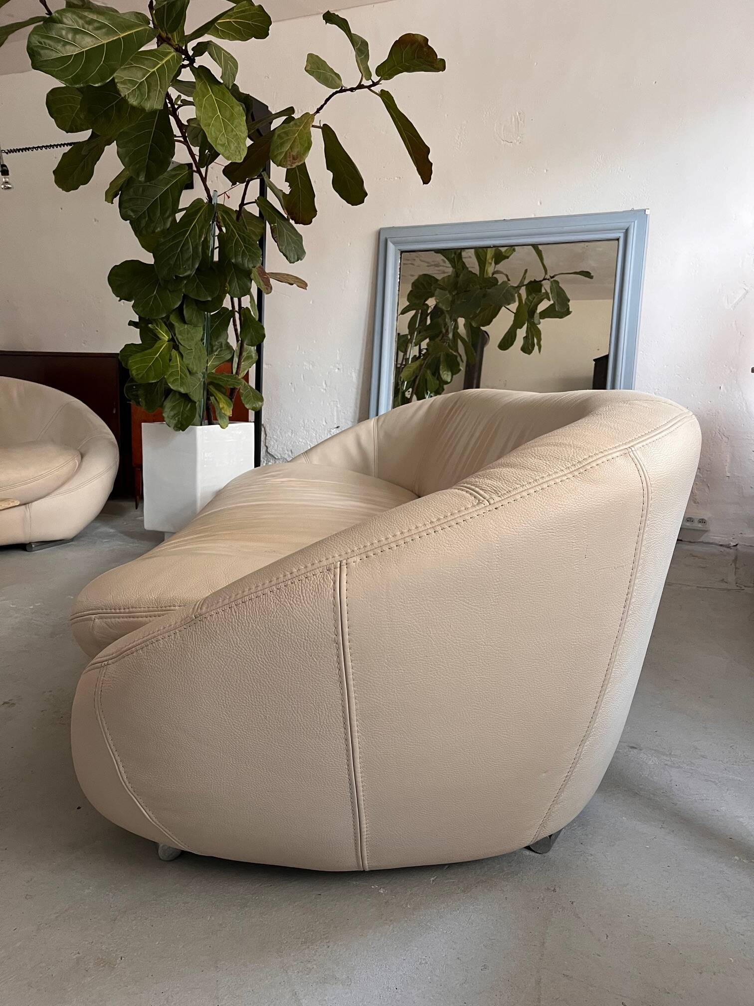 Rounded off-white leather sofa