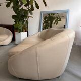 Rounded off-white leather sofa