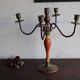 Old candlestick in painted wood and folding metal
