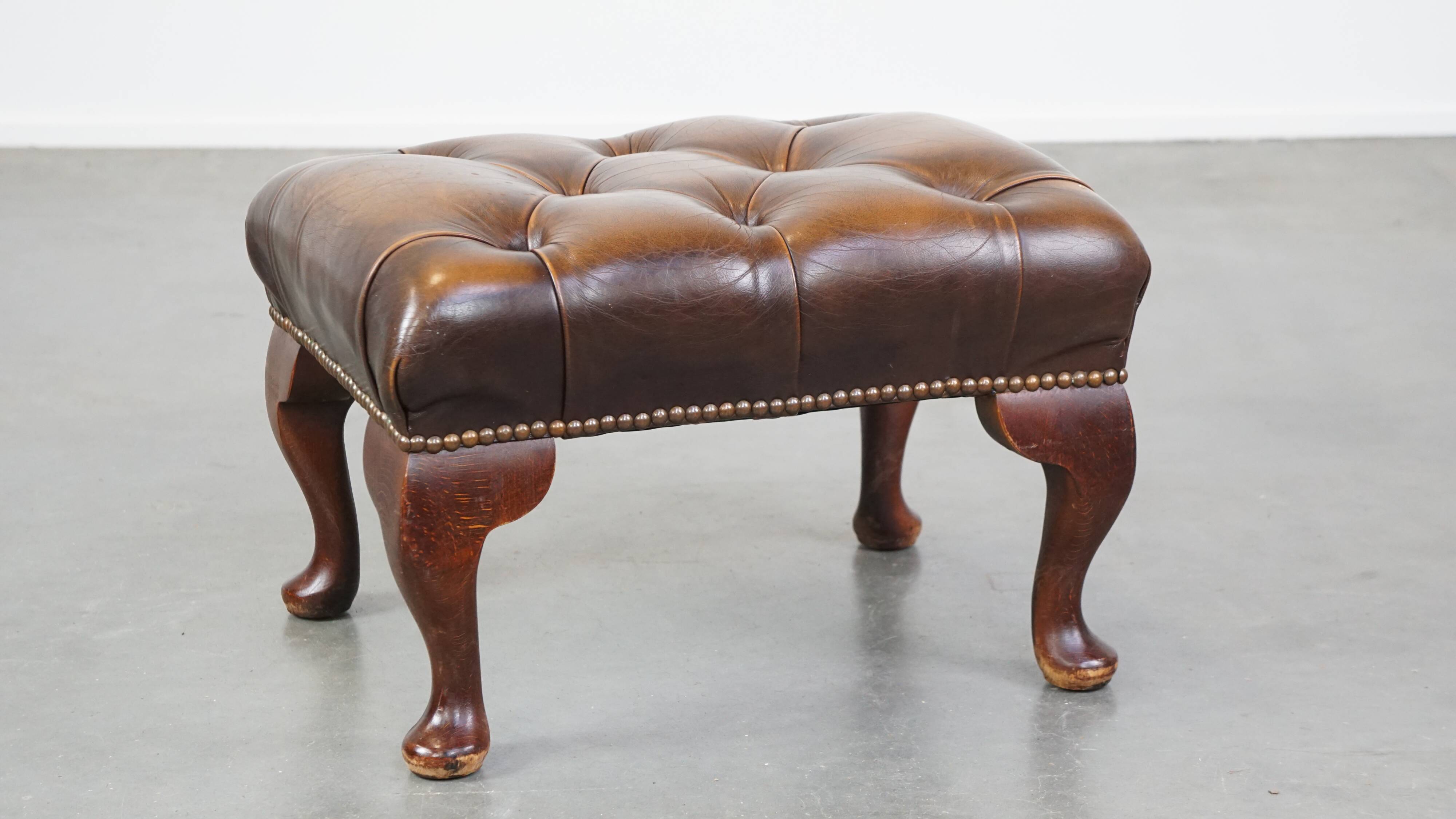 Brown cow leather chesterfield footstool
