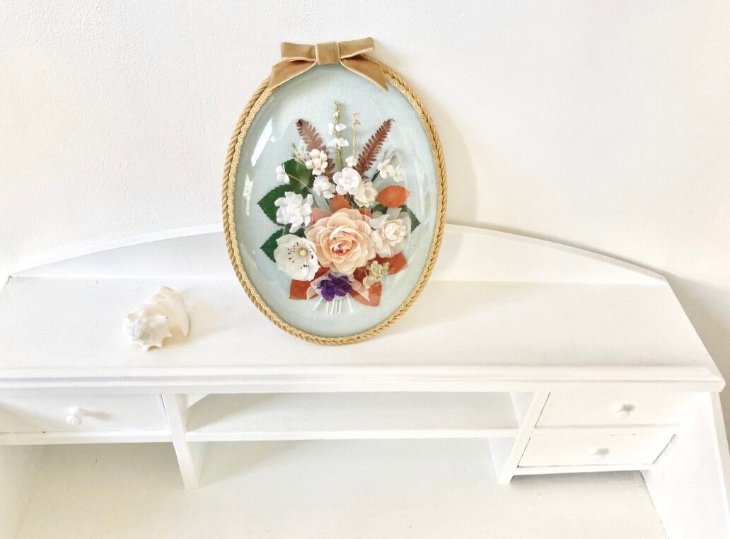 Frame domed glass flowers in fabric