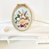 Frame domed glass flowers in fabric