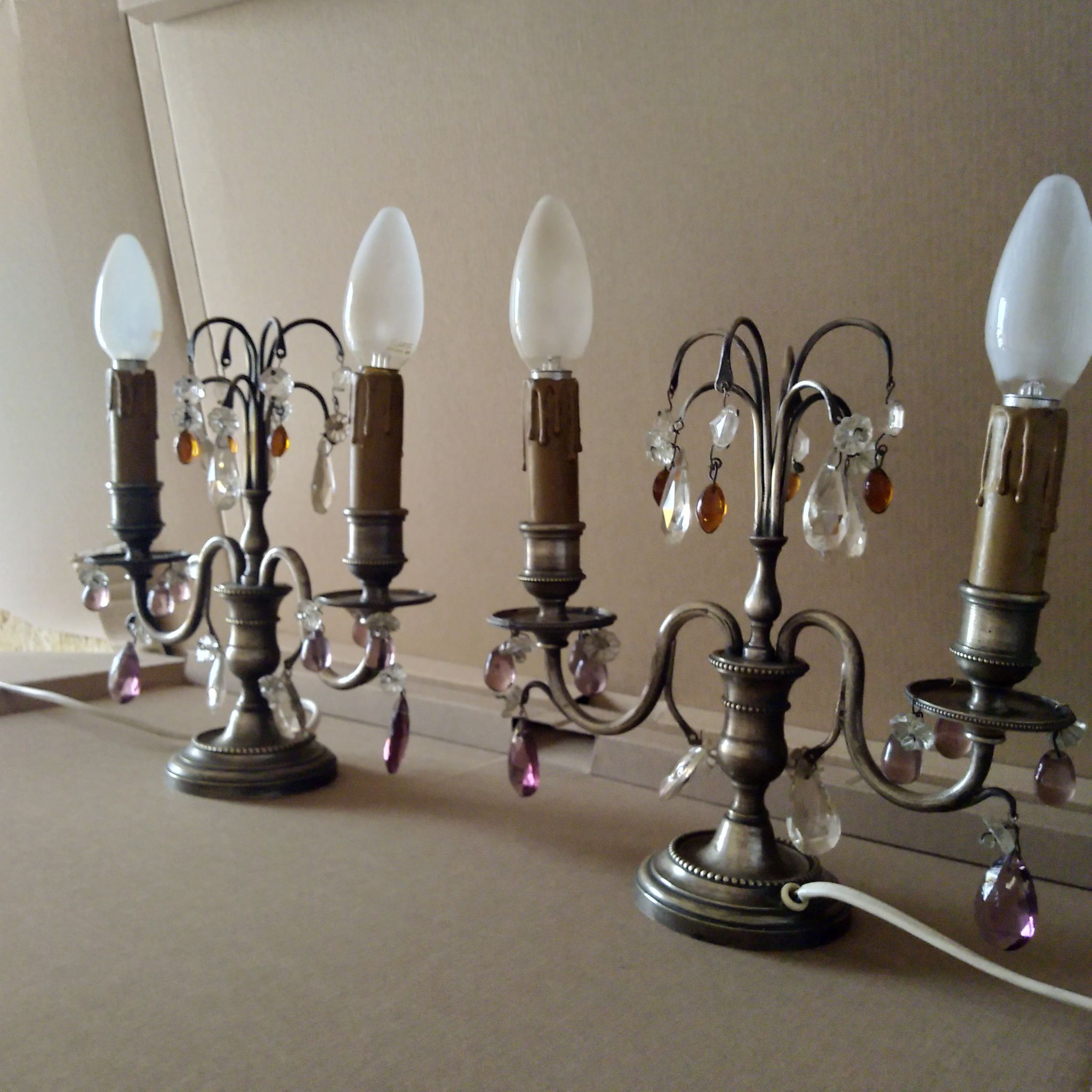 Pair of girandole lamps and silver metal