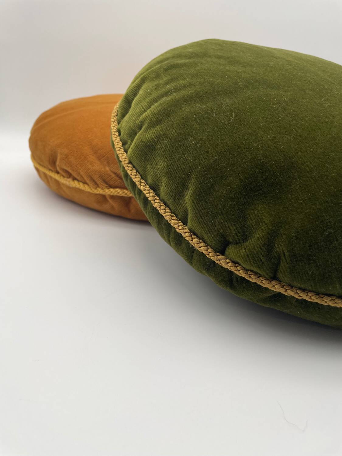 Pair of vintage round velvet cushions