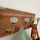 Wall-mounted coat rack with 4 ceramic hooks in blue and white, vintage style.