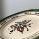 Very decorative serving plate in terracotta, floral and geometric motifs.