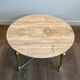 Brass coffee table with a white marble top.