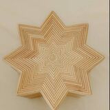 Small star-shaped side table in cream-colored rattan
