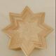Small star-shaped side table in cream-colored rattan