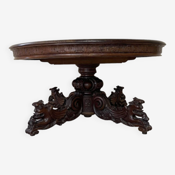 Renaissance style extending pedestal table from a hunting lodge in solid walnut