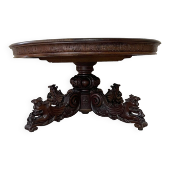 Renaissance style extending pedestal table from a hunting lodge in solid walnut