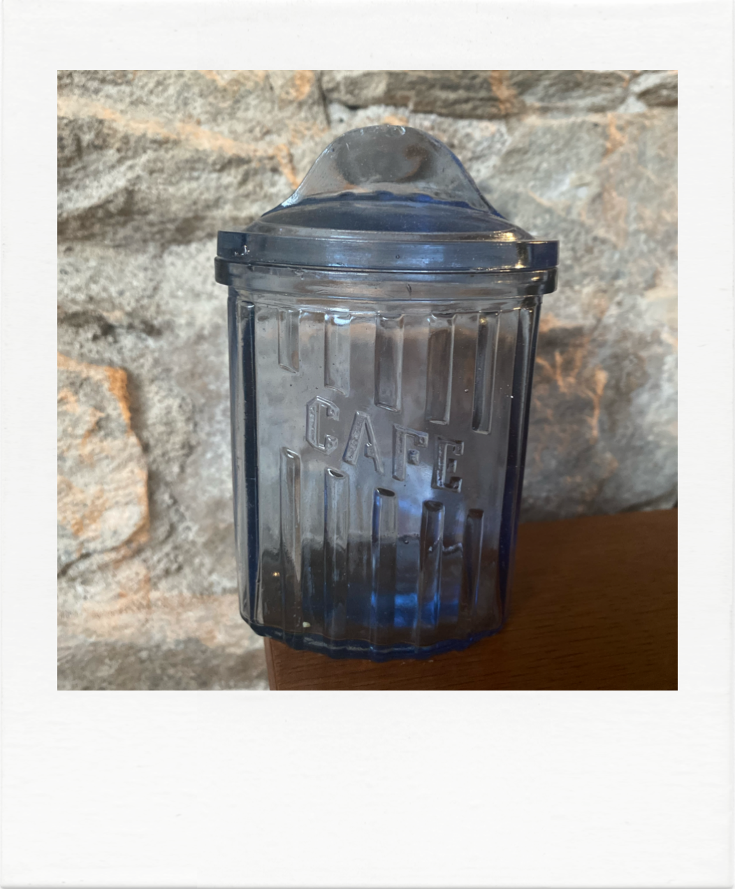 Old coffee pot in blue glass