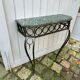 Console in wrought and hammered iron and green marble