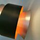 Hanging lamp,  of silver coloured aluminium with black "ring" and orange inner contrast lacquer.