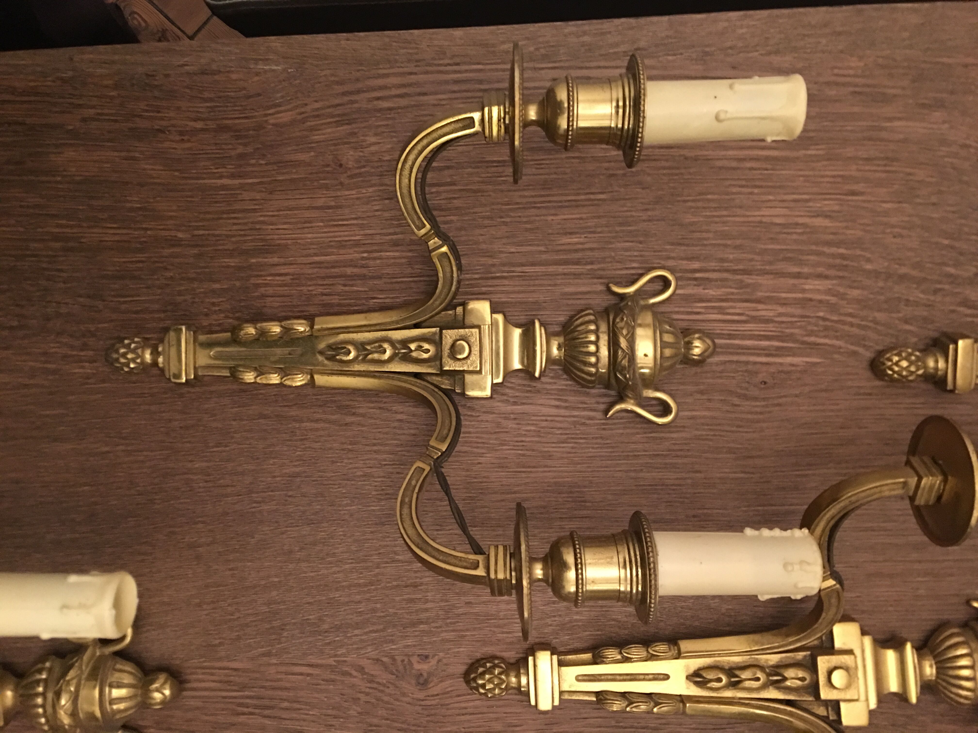 Eleven gilded bronze wall lamps