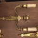 Eleven gilded bronze wall lamps