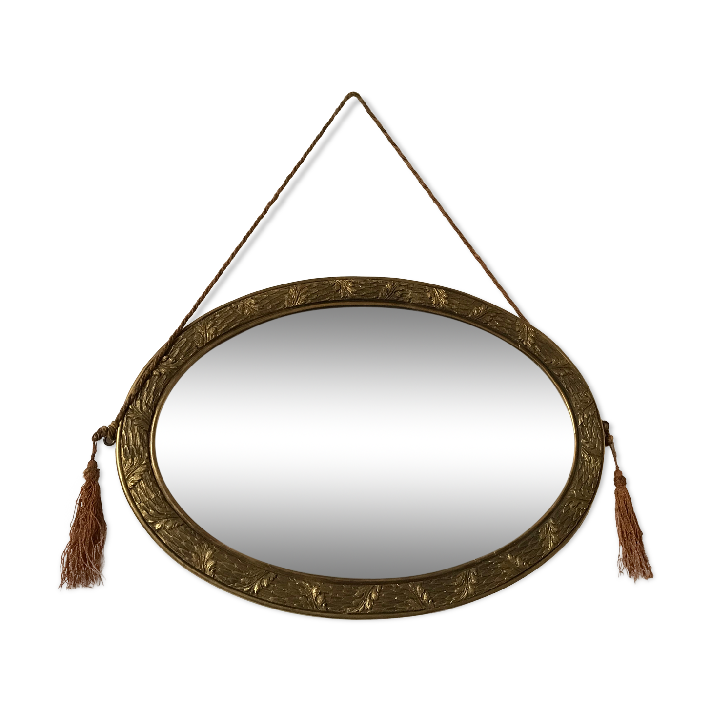 Golden oval mirror with its wooden frame and stucco on wood, nicely cracked by time