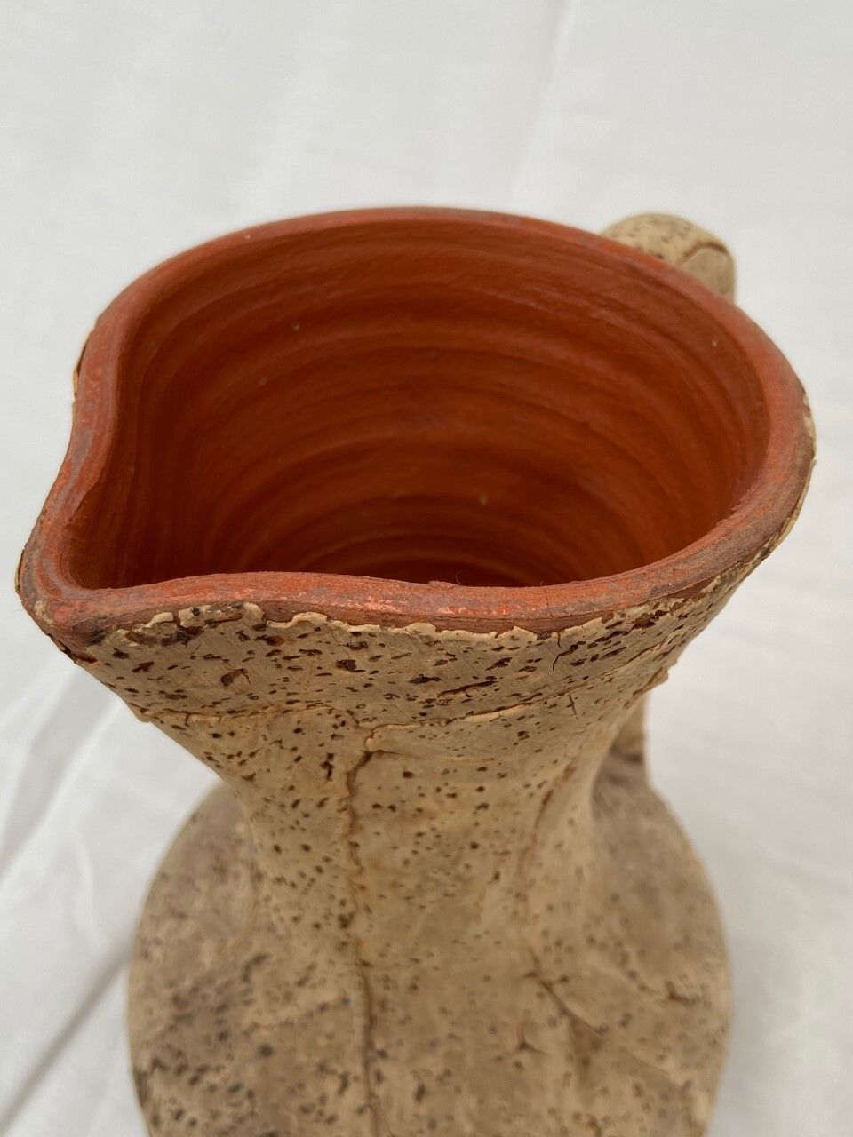 Terracotta jug covered with cork