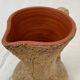 Terracotta jug covered with cork