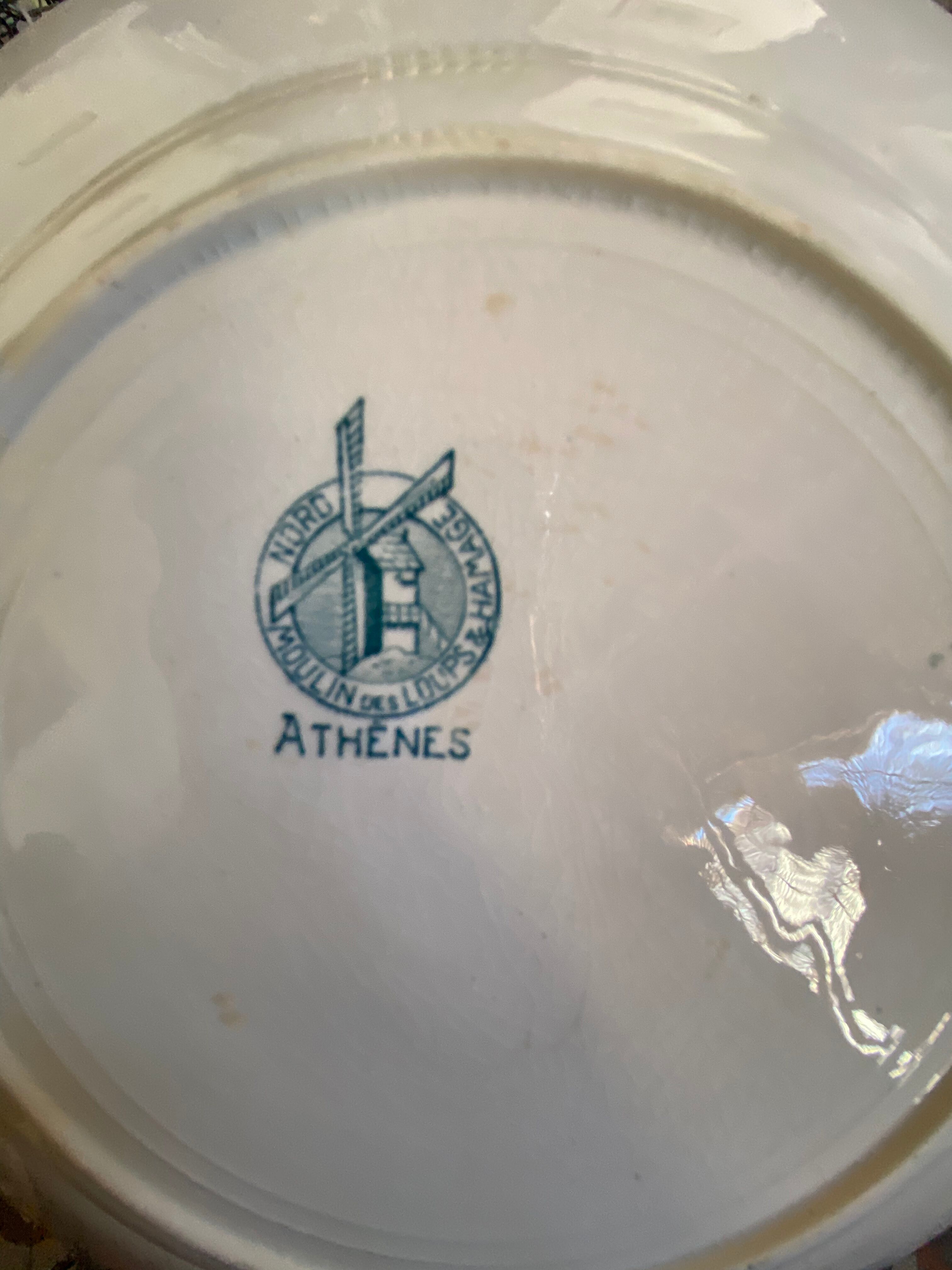 7 matching dessert plates in red green and blue.