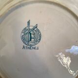 7 matching dessert plates in red green and blue.