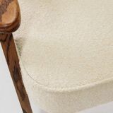 Vintage armchair with rustic wood and beige bouclé design by Chierowsky.