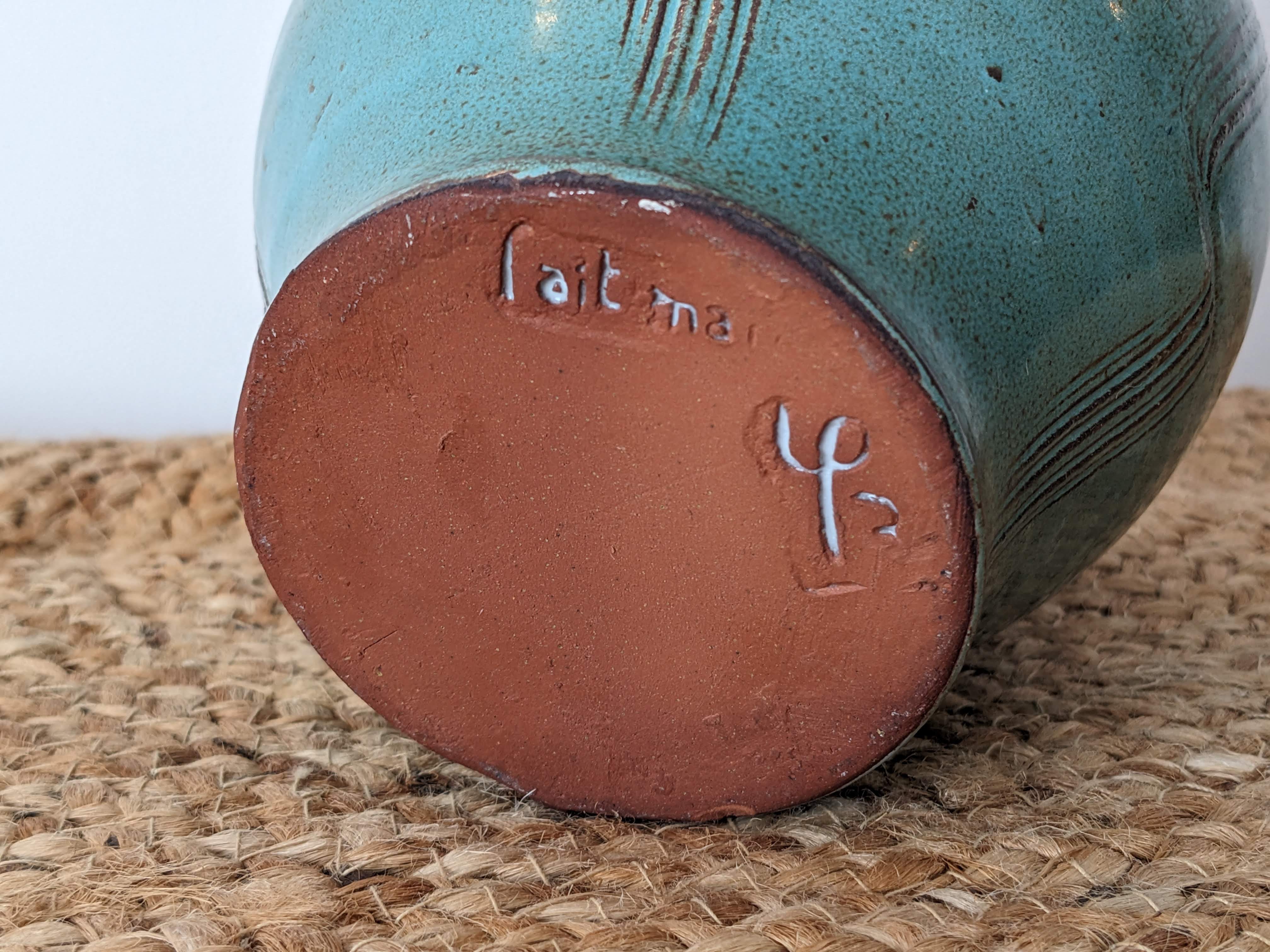 Ceramic pot with rattan handle