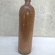 Bottle in sandstone
