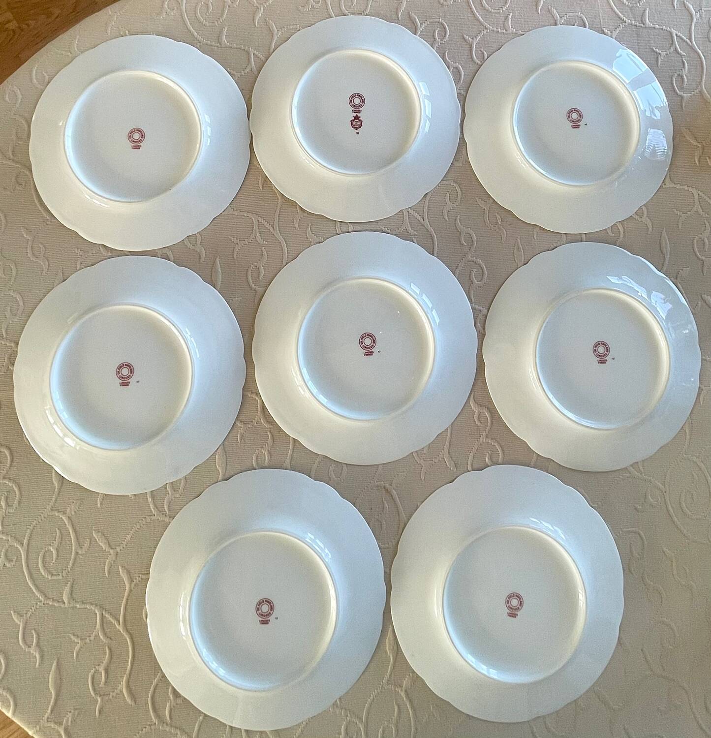 8 Haviland Limoges dinner plates.