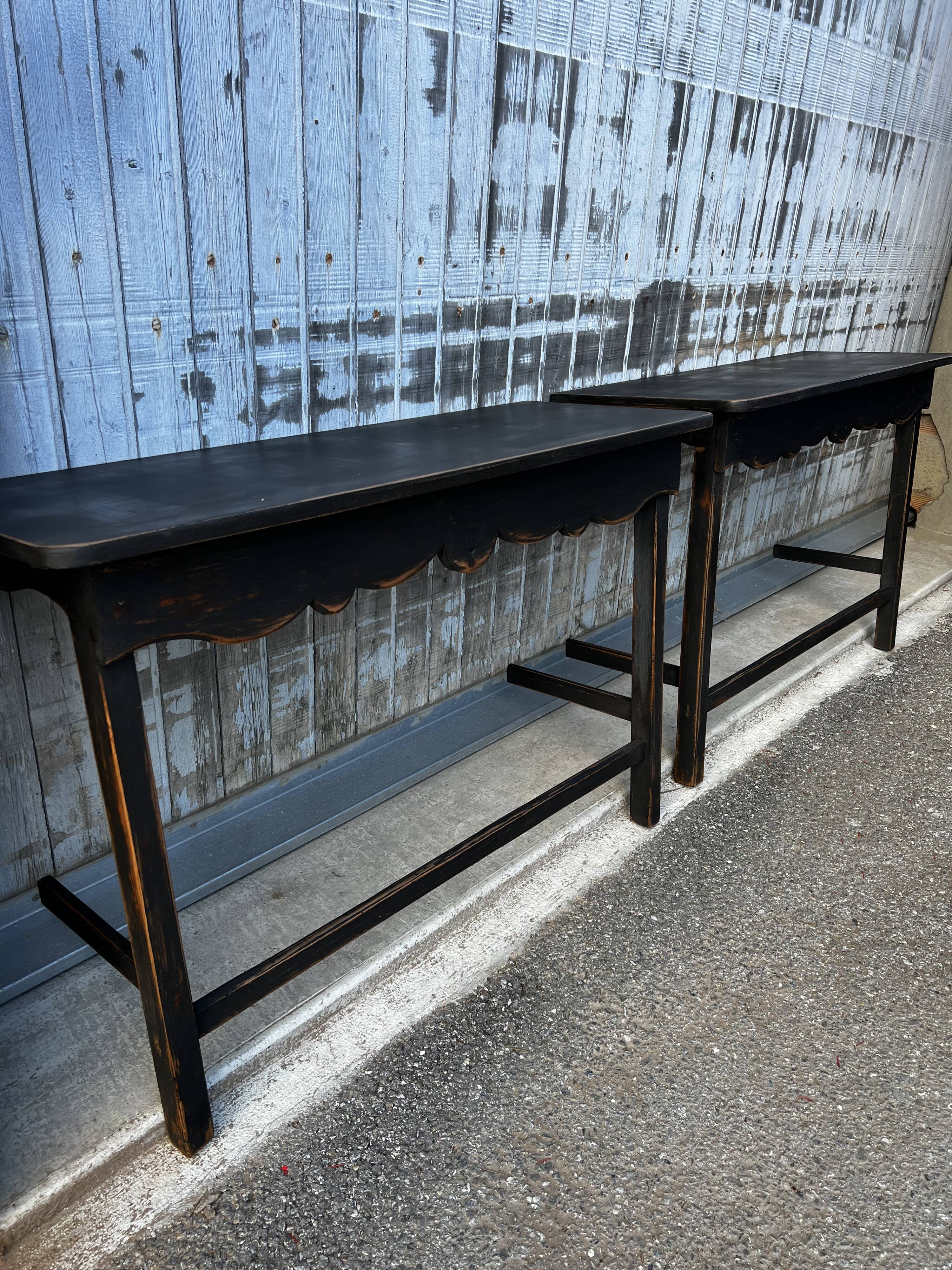 Pair of black patinated consoles
