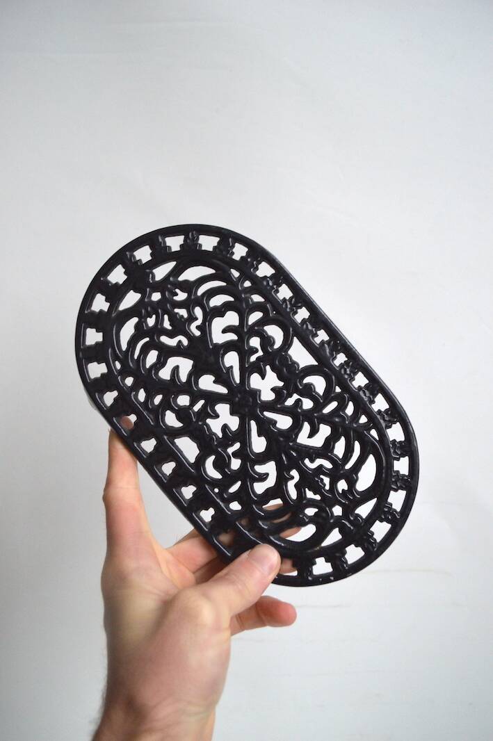 Black cast iron trivet