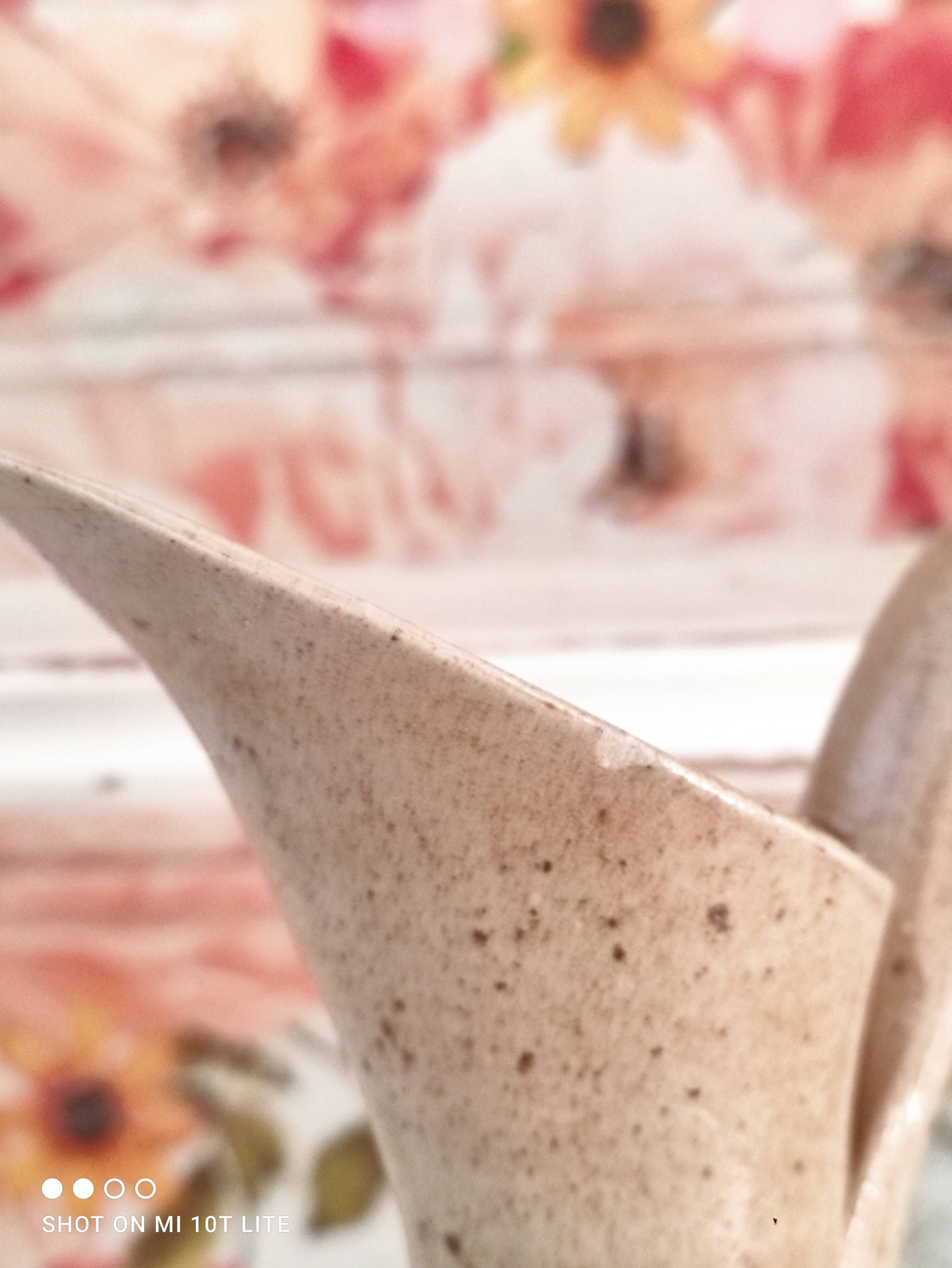 Vintage pitcher in light brown sandstone speckled