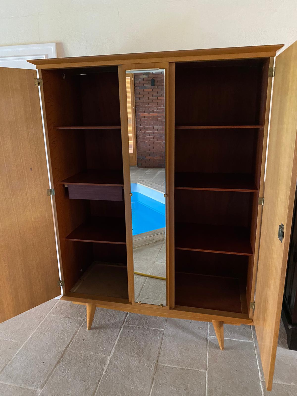 Scandinavian-style wooden cabinet with mirror