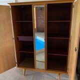 Scandinavian-style wooden cabinet with mirror