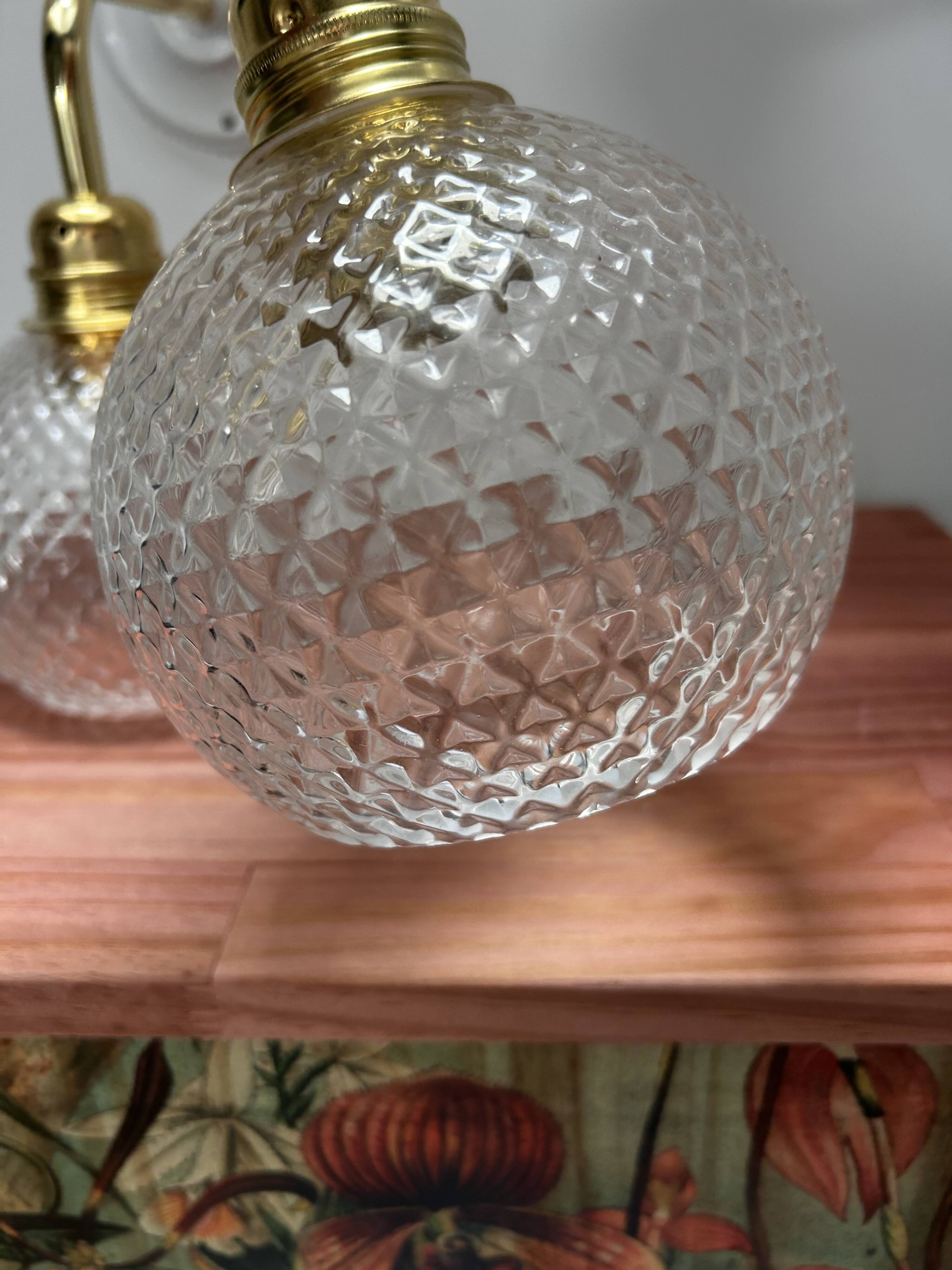 Pair of chiseled glass wall sconces