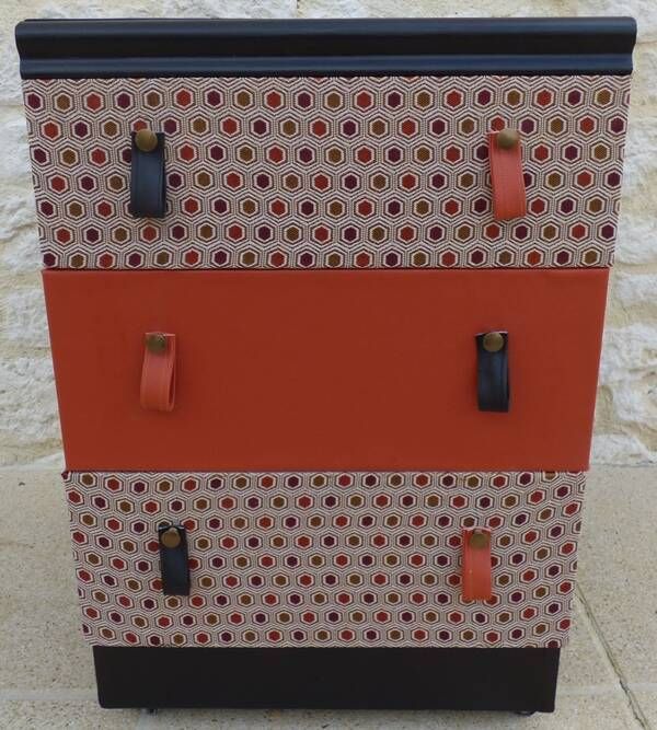 Three-drawer wooden and faux leather chest of drawers on wheels, completely refurbished.