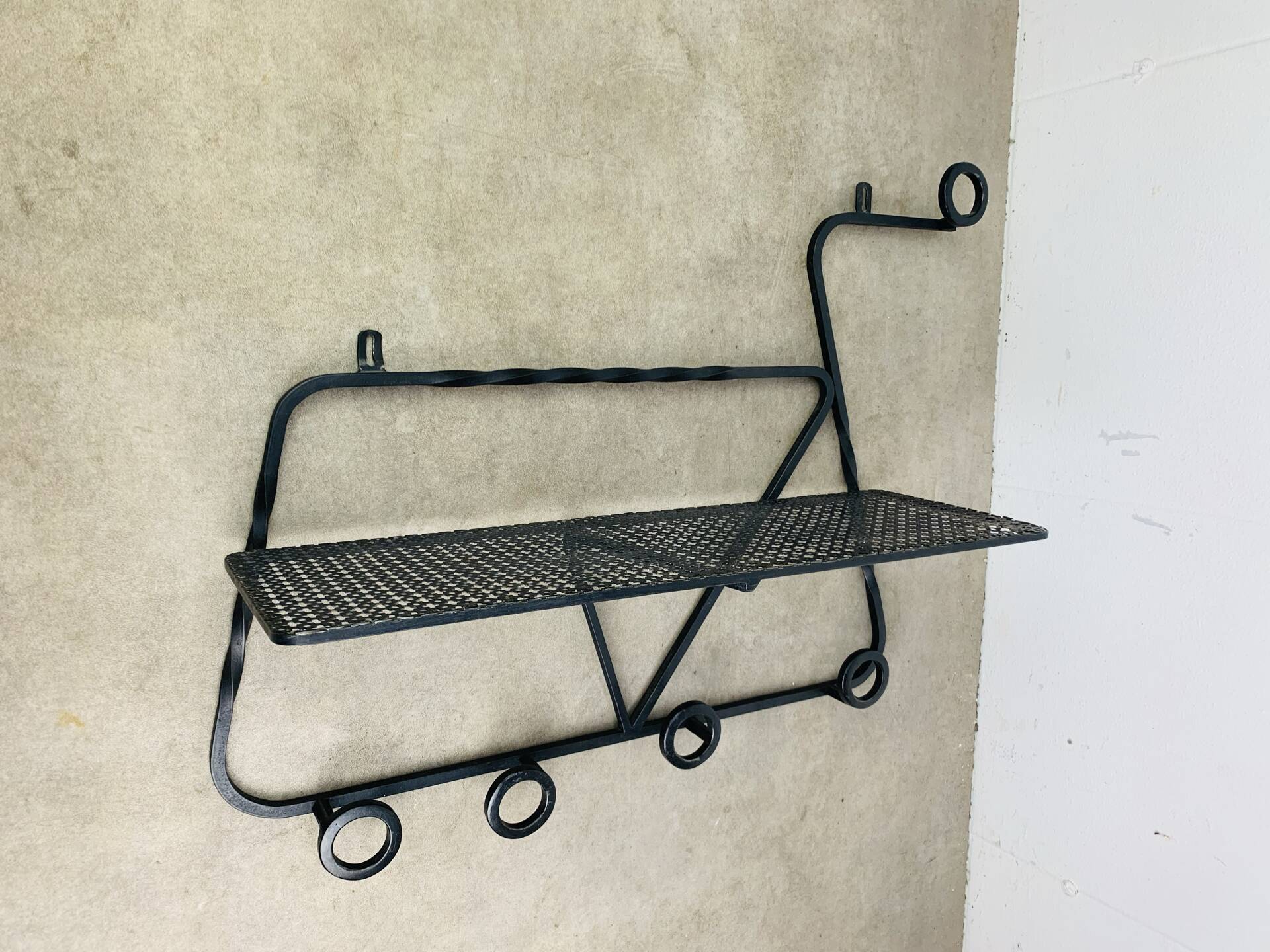 Wall-mounted coat rack/wardrobe from the 1950s, wrought iron and rigidule.
