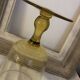 Yellow chalice vase, yellow glass vase on a pedestal.