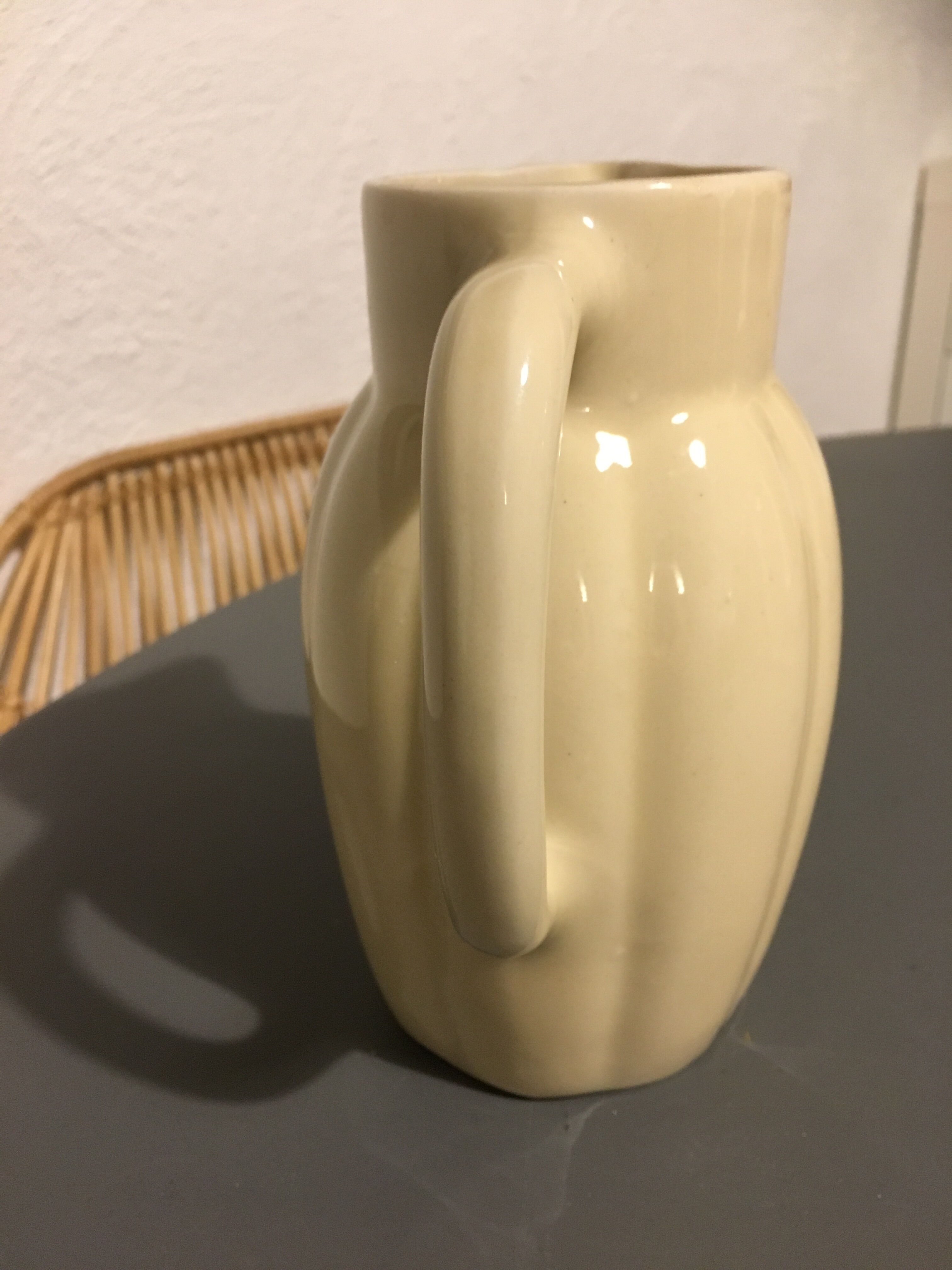 Cream color earthenware pitcher