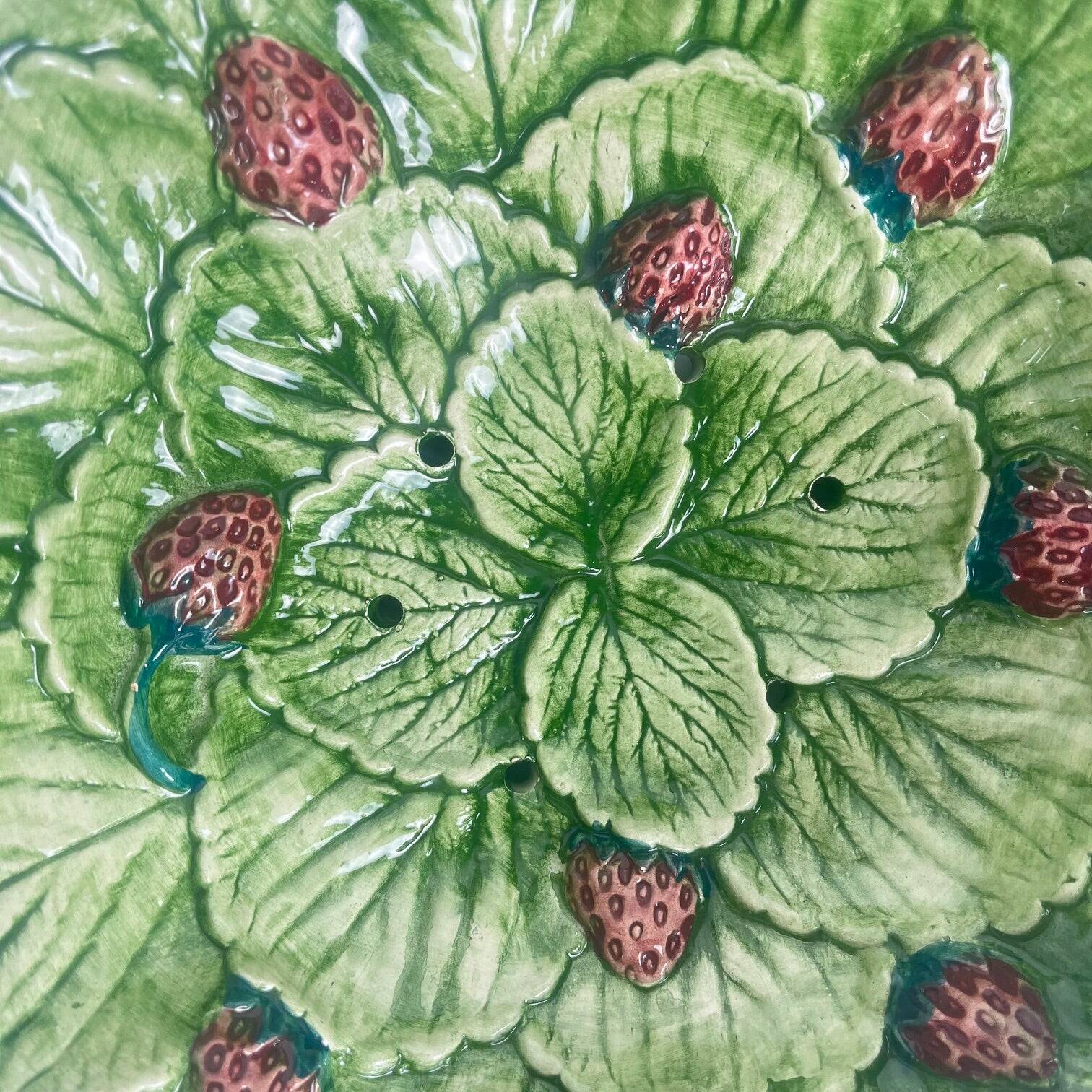 Leaf and strawberry-shaped bowl/strainer.