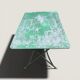 Bistro tables and folding chairs with a patina from the original 1930s.