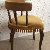 Vintage fringed gondola armchair