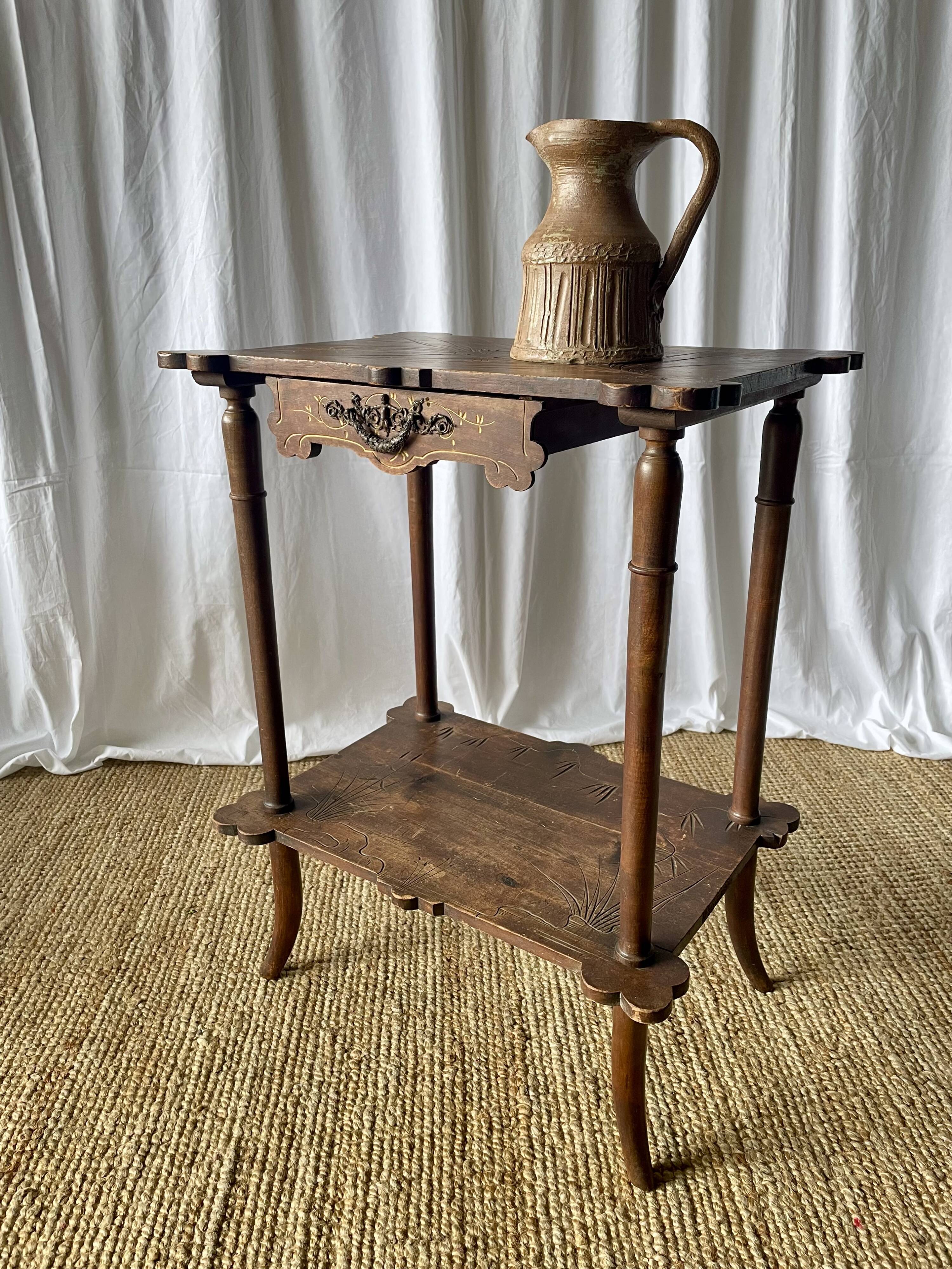 Elegant Art Nouveau side table in walnut, France early 20th century.