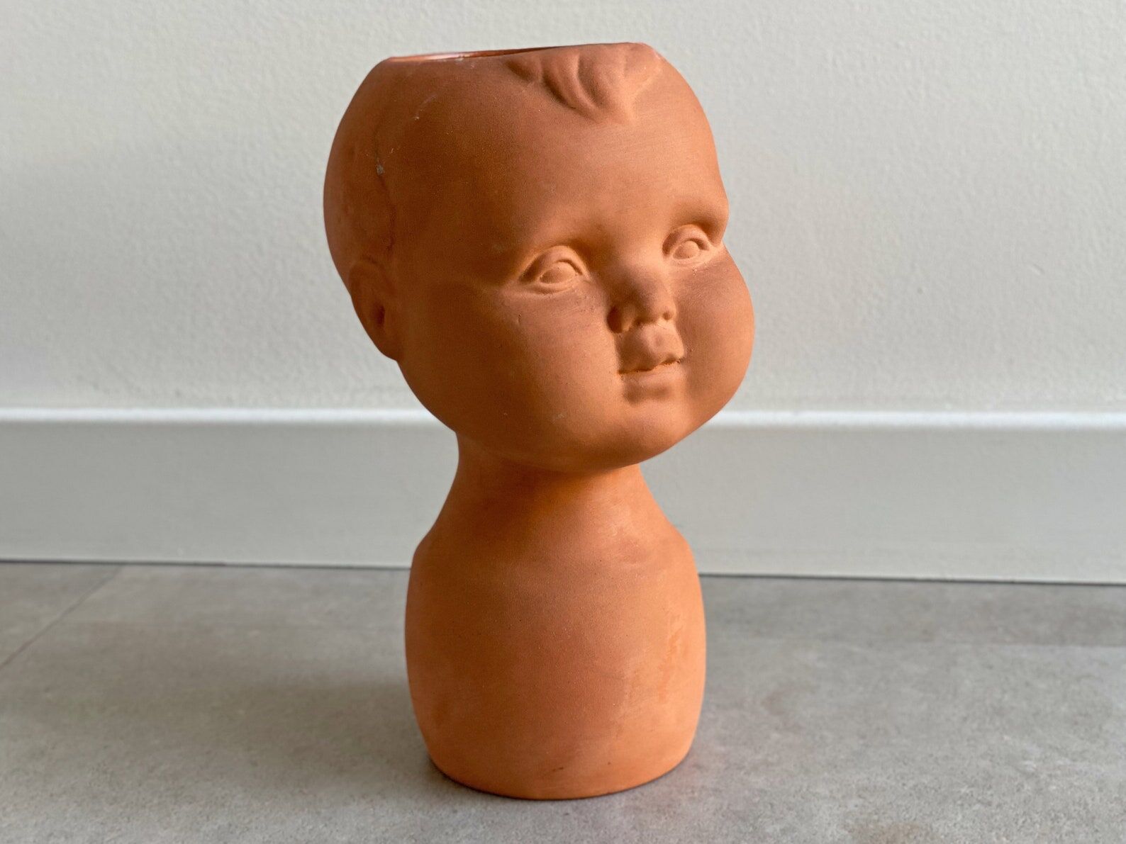 Vintage terracotta kids head vase