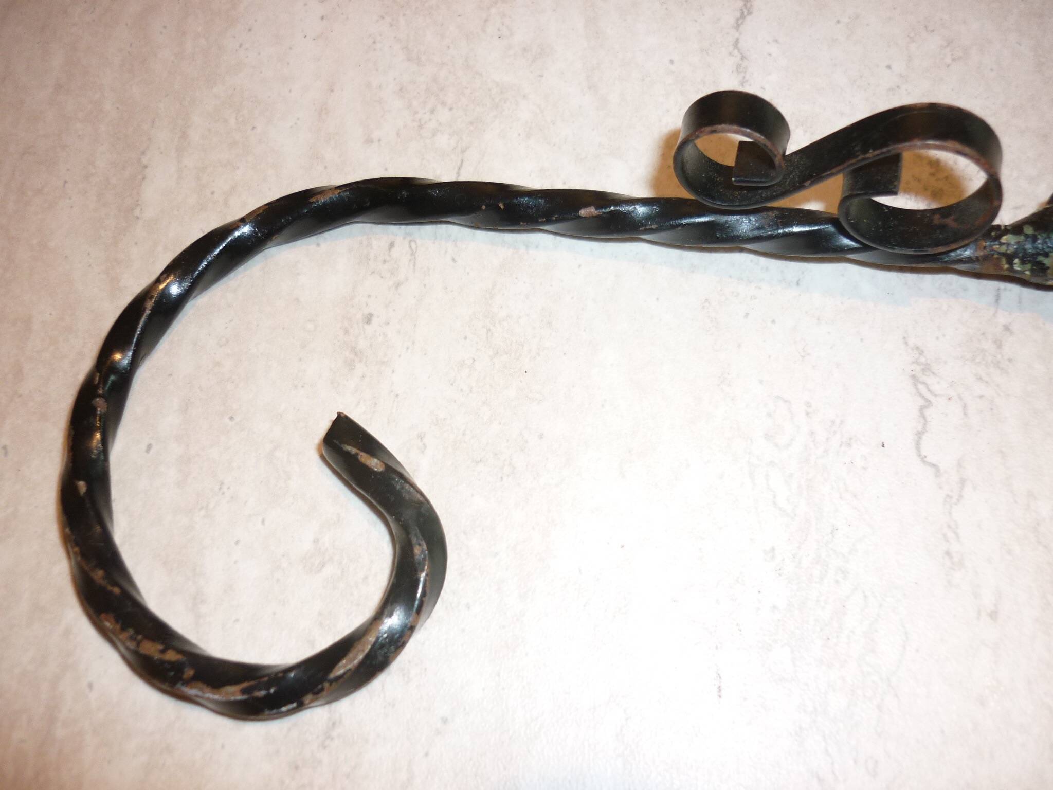 Braided yellow cheese platter and wrought iron