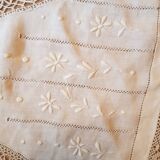 Round hand-embroidered linen tablecloth
