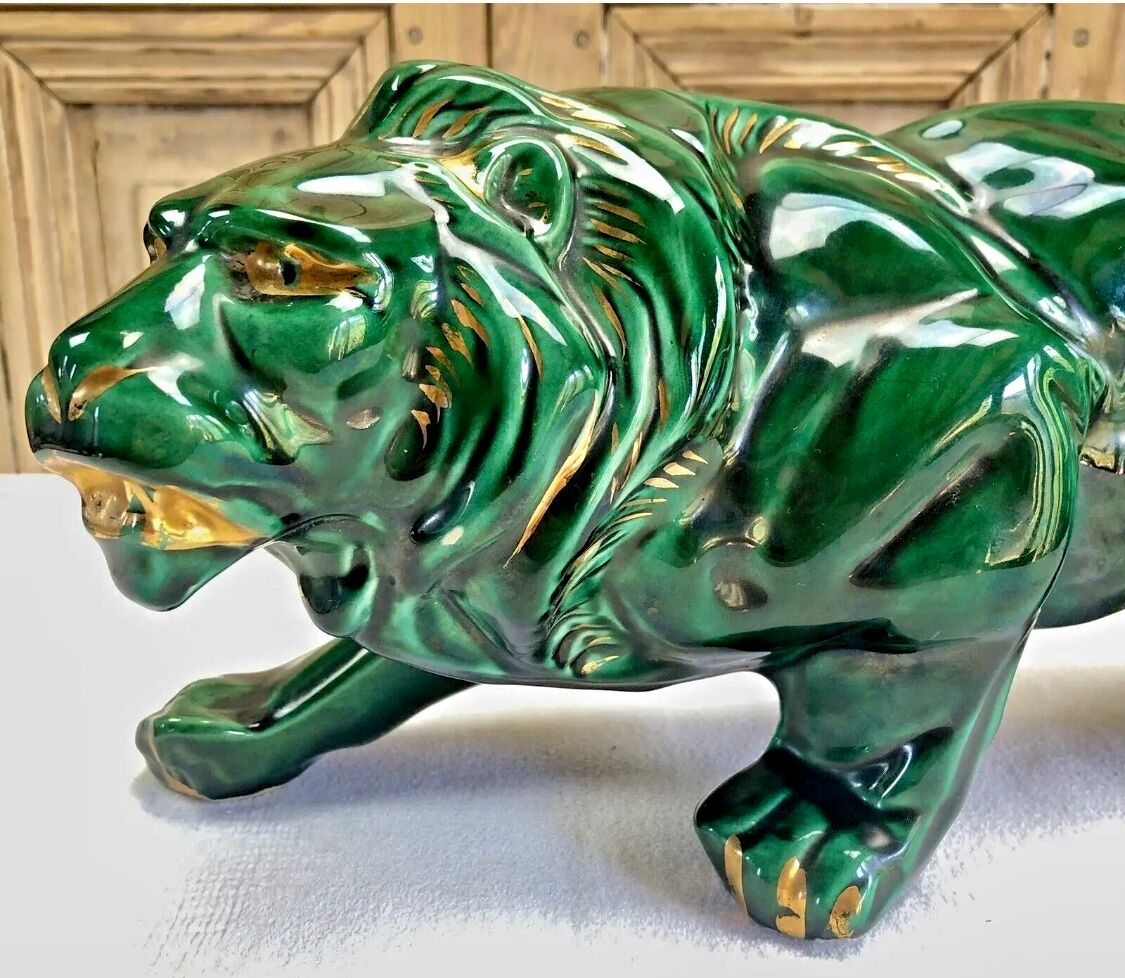Art Deco lion statue cracked St Clement