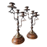Pair of antique wooden and brass candlesticks